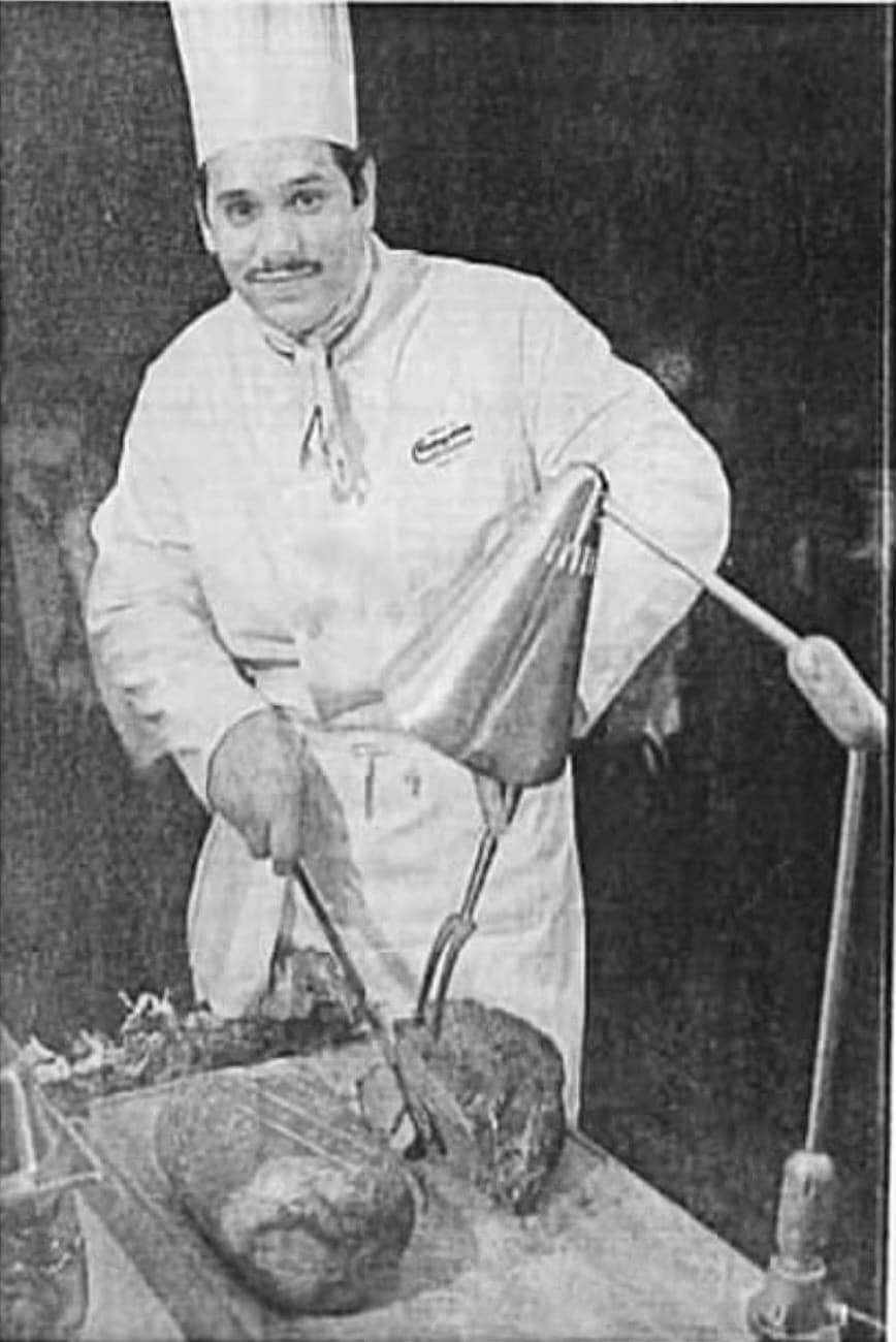 William Rivera in chef's whites, in a newspaper clipping