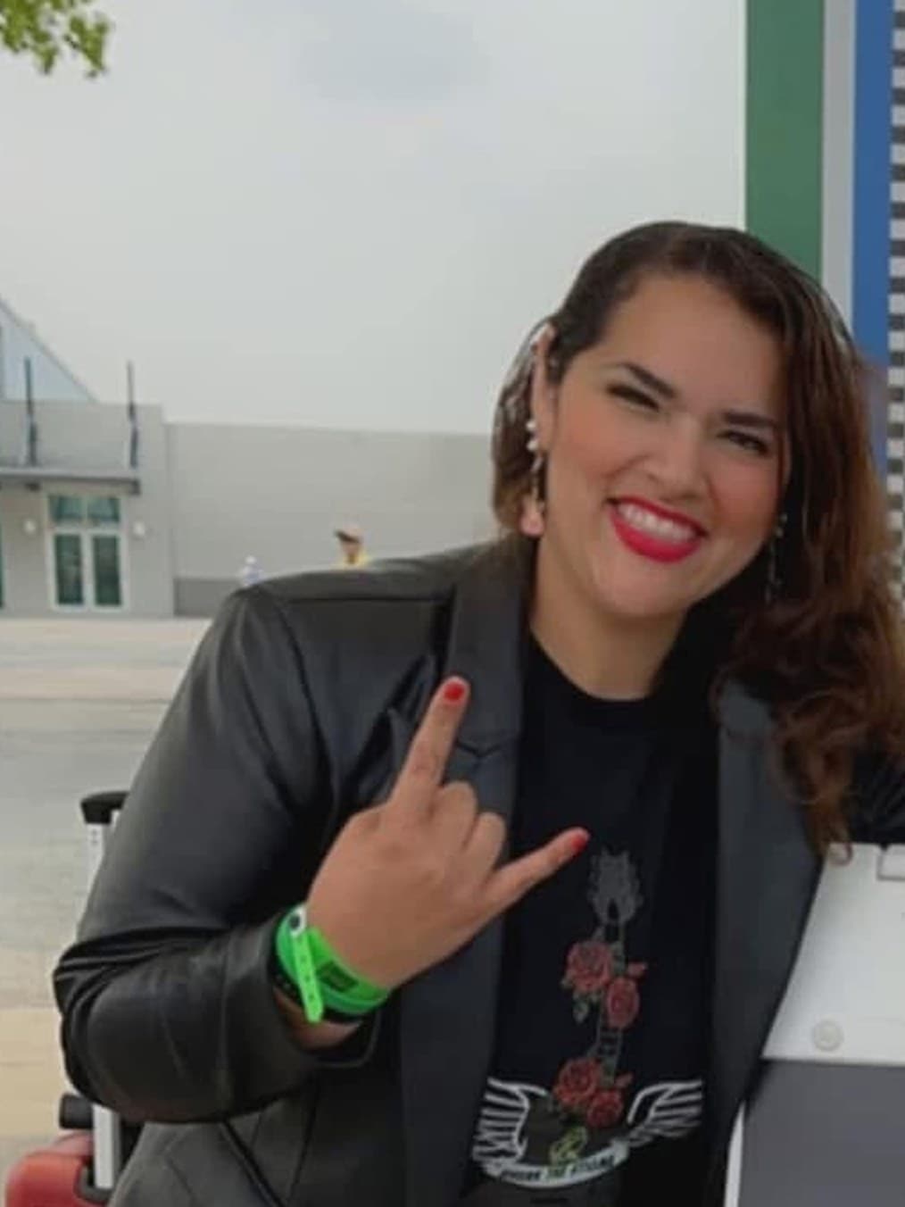 Miriam D. Rivera wearing one of her winged-guitar designs