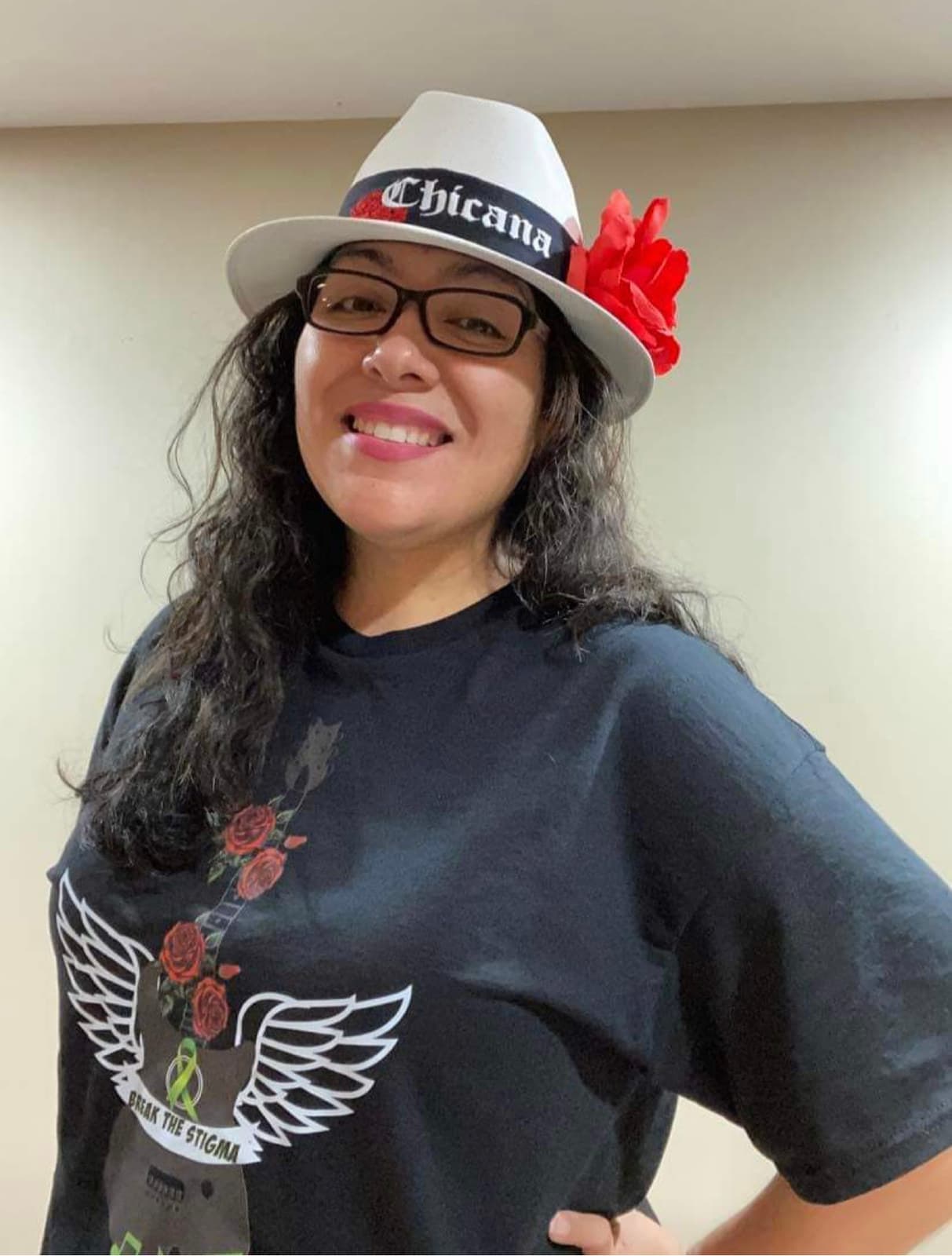 Miriam D. Rivera wearing one of her winged-guitar designs