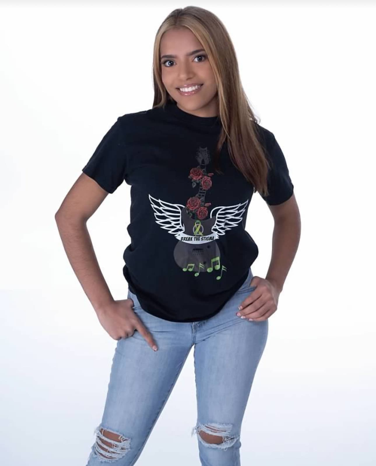 Studio shot of the winged-guitar tee