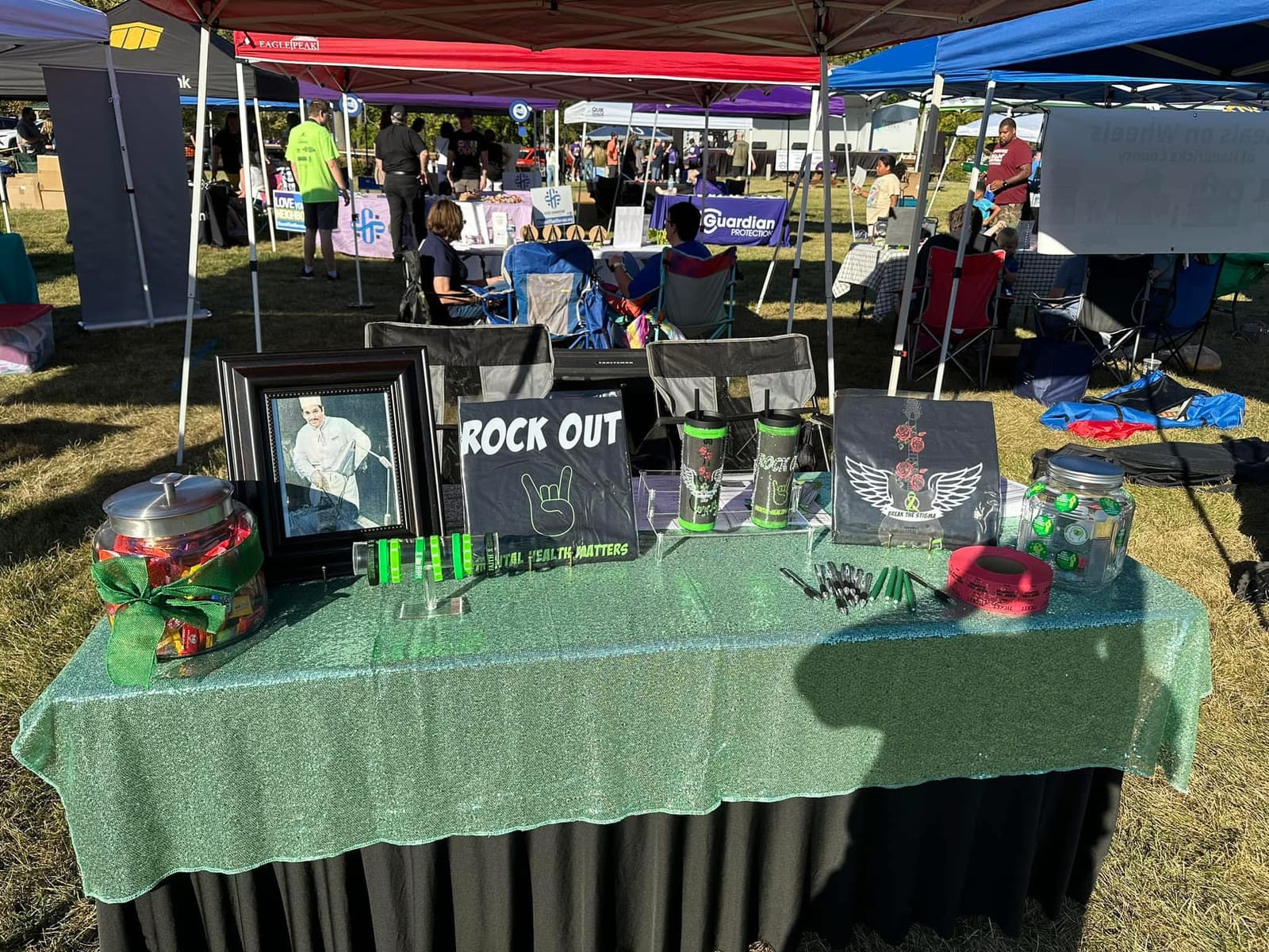 The Rock Out for Mental Health vendor booth at a community event